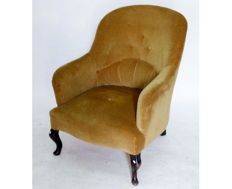 An Edwardian tub chair with button upholstery 