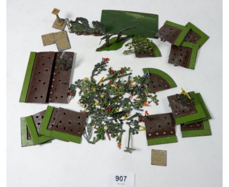 A Britains painted lead garden set including sundial and crazy paving