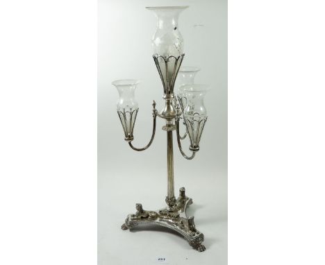 A silver plated epergne with cast sphinx to triple base and fitted four etched glass flutes 