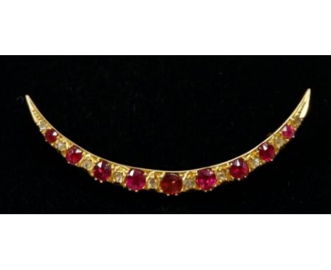 A 15 carat gold crescent form brooch set ruby and diamonds, 4.5cm, total weight 3g 