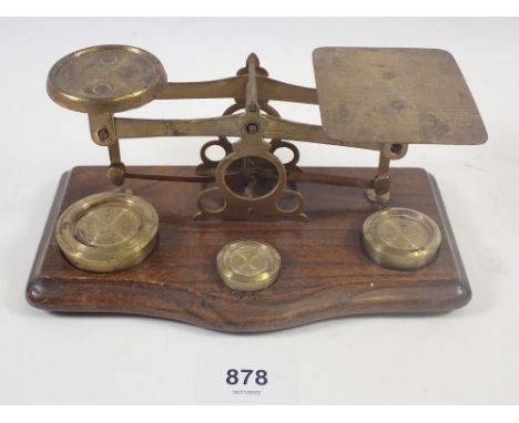 A set of brass and oak postal scales 