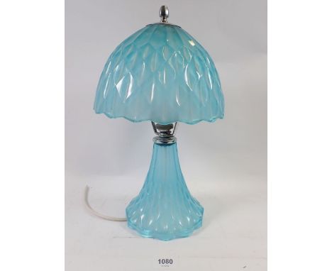 A 1930's blue glass table lamp and shade, 26cm tall