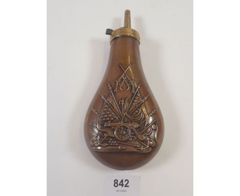 A brass and copper powder flask embossed artillery motifs 