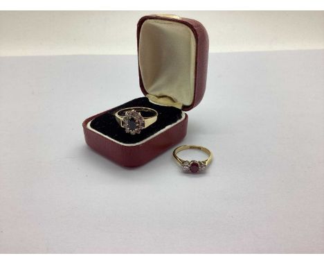 A Diamond Set Three Stone Ring, claw set, stamped "18ct&amp;Plat" (finger size L); A 9ct Gold Cluster Dress Ring, oval claw s