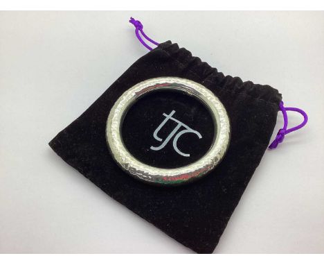 A Modern Chunky Bangle, of textured design, stamped "925" (internal diameter 6.5cm).