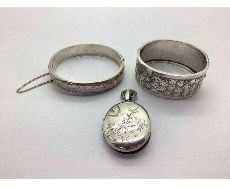 A Victorian Aesthetic Oval Locket Pendant, together with a vintage wide hinged bangle and a hallmarked silver hinged bangle, 