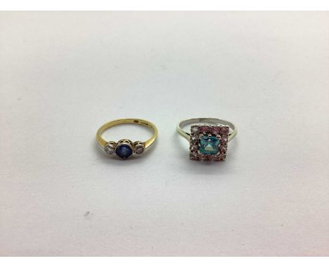 An 18ct Gold Diamond Set Three Stone Ring, graduated collet set (finger size O); together with a blue zircon set square clust