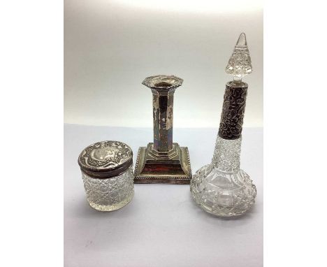 A Hallmarked Silver Candlestick, 13cm high (weighted); together with a decorative hallmarked silver mounted cut glass scent b