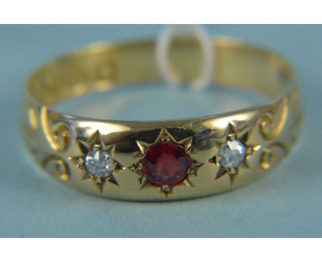 An 18ct gold diamond and red stone set ring, size P, weight approx 2.5g