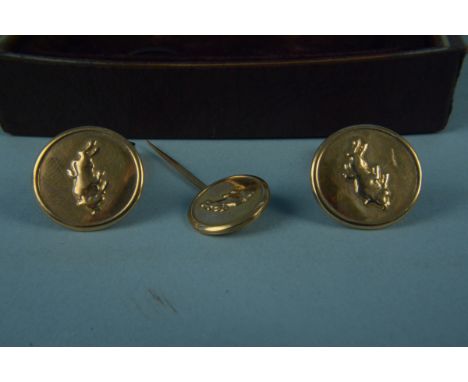A pair of circular 9ct gold bull design cufflinks with matching tie pin, weight approx 11.5g