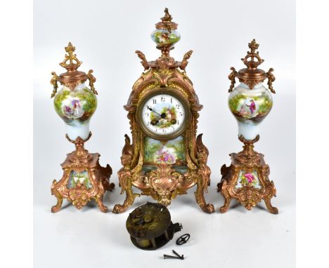 A late 19th century French bronzed metal and overpainted transfer decorated porcelain mantel clock and garniture, the clock i