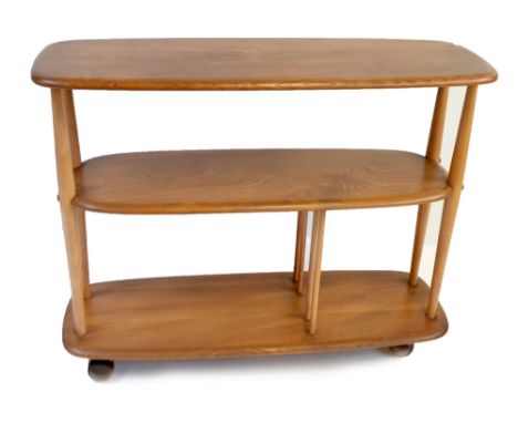 ERCOL; a medium elm three tier bookcase trolley, height 71cm, length 91cm, depth 31.5cm.Additional InformationLight scratches