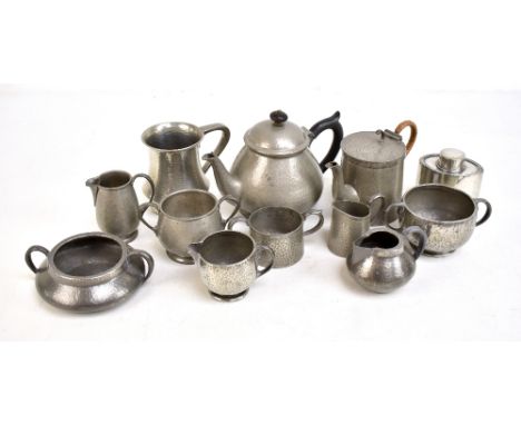 ENGLISH PEWTER; a mixed group of tea and coffee ware, the majority with planished decoration to include a three piece tea ser