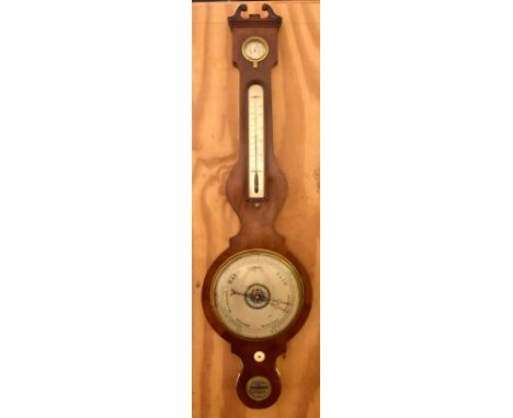 A late 19th/early 20th century mahogany banjo barometer and thermometer with silvered dials and carved bone knob, length 97cm