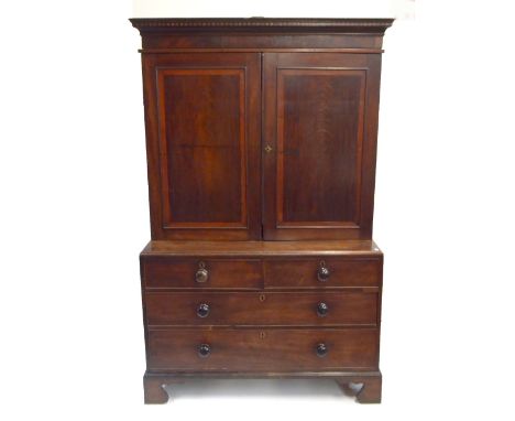A Georgian crossbanded mahogany linen press, the twin panelled doors enclosing oak shelf and two later pine shelves above an 