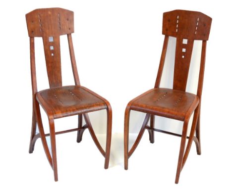 MICHAEL THONET; a pair of bentwood chairs in the manner of Joseph Hoffman with pierced stylised detail and partial original l