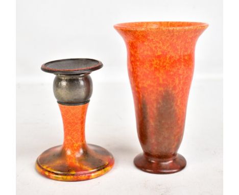 ROYAL LANCASTRIAN; an Arts &amp; Crafts candlestick with pewter collar and detachable drip tray, decorated in orange vermilio