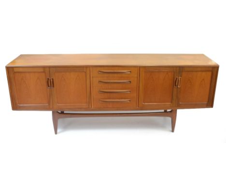 V.B. WILKINS FOR G-PLAN; a Fresco teak 'Long John' sideboard with four central drawers flanked on either side by two panelled