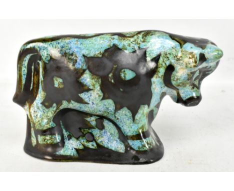 WILLIAM AND MAGGIE FISHER FOR CELTIC POTTERY; a hand painted model of a bull, height 12cm, length 23cm.Additional Information