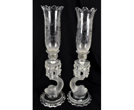 BACCARAT; a pair of clear and frosted glass dolphin candle holders, with detachable shades, height 59cm.Additional Informatio