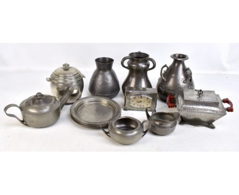 A collection of Arts &amp; Crafts pewter to include an English Pewter three handled vase, impressed marks and No.7059 to base