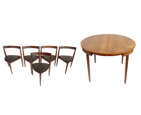 HANS OLSEN (1919-1992) FOR FREM ROJLE; a Danish teak dining suite comprising circular extending dining table with extra leaf 