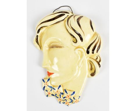 CLARICE CLIFF; an Art Deco wall mask depicting a portrait bust of a lady with angular base and blue and orange painted highli