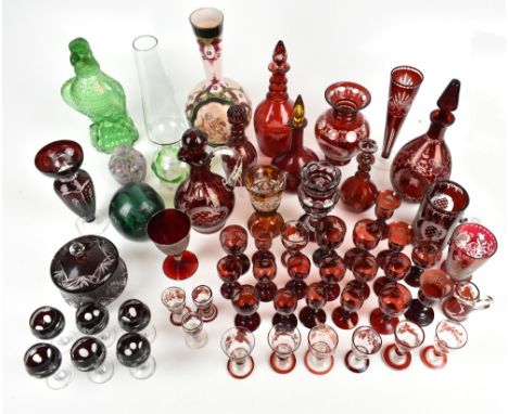 A mixed group of glass with Bohemian ruby and ruby tinted glass tableware comprising two decanters with triple ring necks, nu