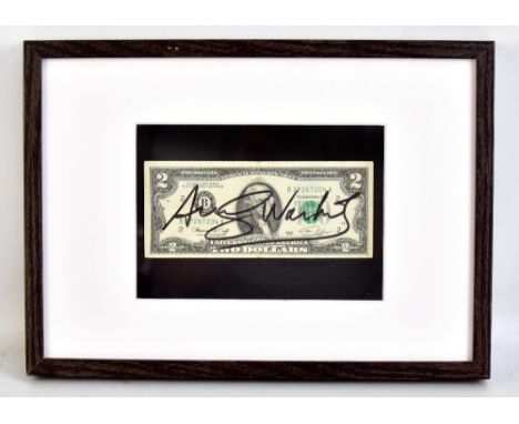 ANDY WARHOL (American, 1928-1987); a $2 bill signed in black felt tip pen, the bill Series 1976, S/N B37267204A and featuring