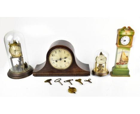 A 1940s oak dome topped mantel clock with silvered dial, width 40cm, a Wileman &amp; Co Foley faience miniature clock in the 