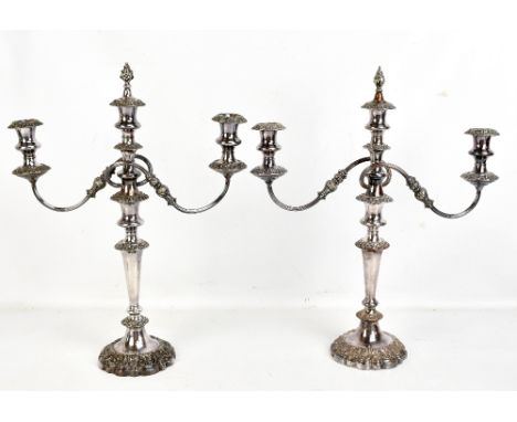 A pair of 19th century silver plated three light candelabra, each with the facility to remove the upper section and be used a