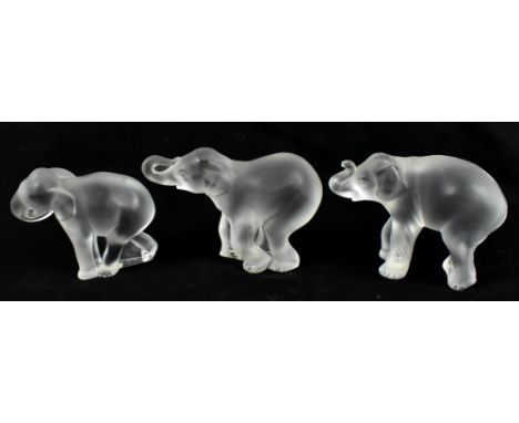 LALIQUE FRANCE; a family of three frosted glass elephants, length of largest 12cm, each fitted in original box.Additional Inf