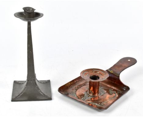 NEWLYN; an Arts &amp; Crafts copper chamber stick with repoussé decoration depicting fish, with detachable sconce, length 25c