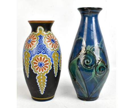 DANICO; a Danish ceramic vase with stylised decoration on a blue ground, impressed marks to base, height 31cm, together with 