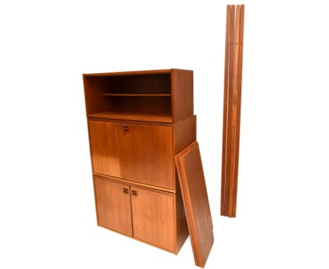 P. S. MOBLER; a Danish teak six piece modular shelving system, comprising cabinet with sliding glazed doors, cupboard with tw