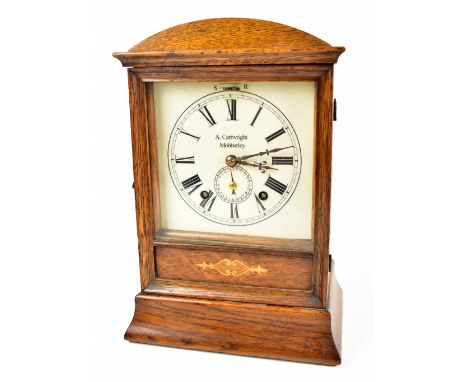 An Edwardian oak mantel clock with later printed dial set with Roman numerals, inscribed 'A. Cartwright, Mobberley', height 3