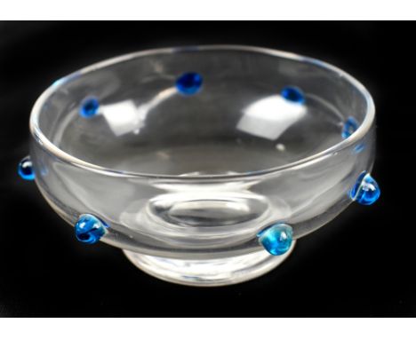 IN THE MANNER OF STUART; a late 19th century small clear glass finger bowl with applied blue drop detail on splayed circular 