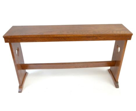 An Arts and Crafts oak bench with carved love heart side panels, length 118cm.Additional InformationLight general wear.