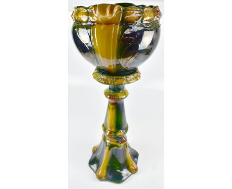 An Art Nouveau-style ceramic jardinière on stand with foliate detail, unmarked, combined height 89cm.Additional InformationLi