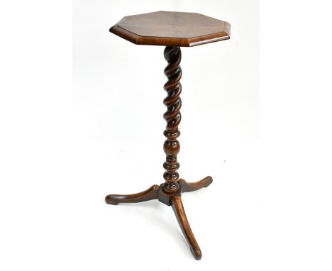 An 18th century Continental walnut candle stand in the English&nbsp;Queen Anne manner, the octagonal radially veneered top ab