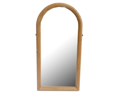 A domed pine mirror formally from a cheval mirror, height 131cm, width 64cm.Additional InformationIt still has part of the si