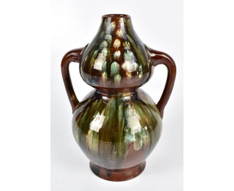 CHRISTOPHER DRESSER (1834-1904) FOR LINTHORPE; an art pottery twin handled double gourd vase with green and brown dripped dec