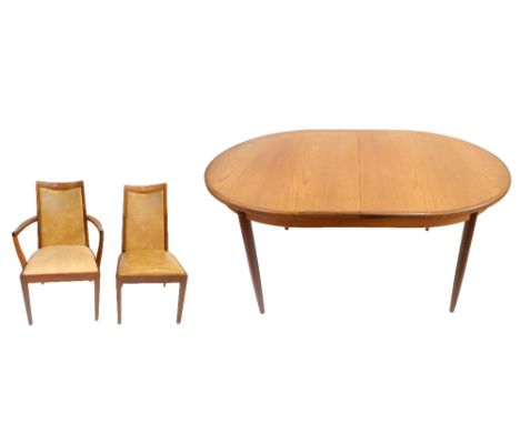 G-PLAN; a Fresco teak dining suite comprising oval extending dining table with extra leaf, length unextended approx 162cm, an