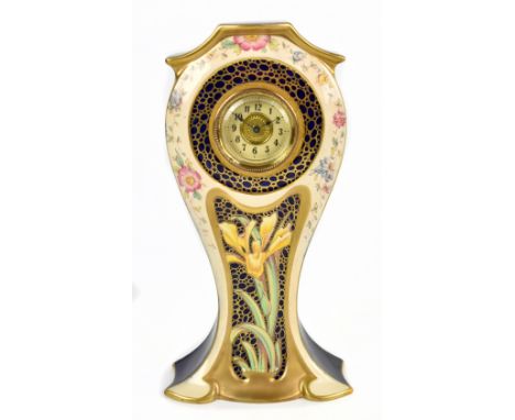 WILEMAN &amp; CO; a faience 'Old Chelsea' mantel clock, painted with a central iris surrounded by floral sprays, pattern no.8