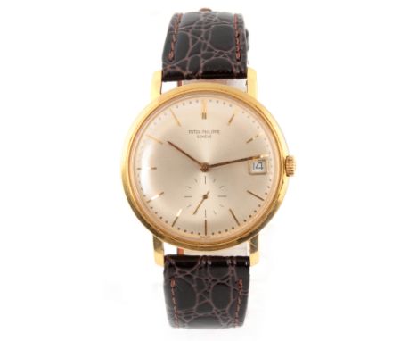 A GENTLEMANS VINTAGE 1960's 18CT GOLD PATEK PHILIPPE CALATRAVA WRIST WATCH REF. 3445 on crocodile leather strap, the slightly