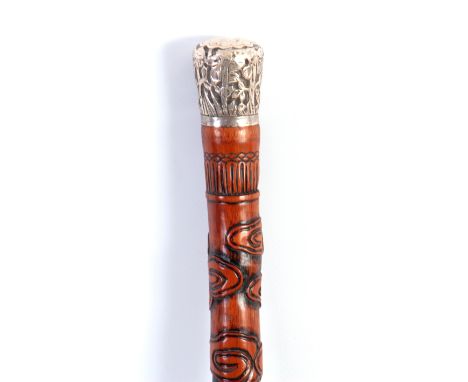 A LARGE 19TH CENTURY CARVED MALACCA CHINESE WALKING STICK with carved shaft depicting animals and figures in a mountainous la