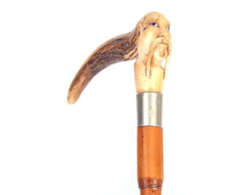 A 19TH CENTURY CHINESE MALACCA AND CARVED HORN WALKING STICK with figural stag horn carved handle and stepped malacca shaft 9