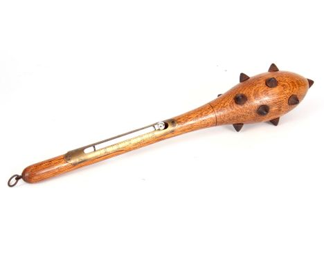 AN EARLY 20TH CENTURY NOVELTY OAK HANGING THERMOMETER FORMED AS A MACE  with club end set with steel spikes, fitted with a br