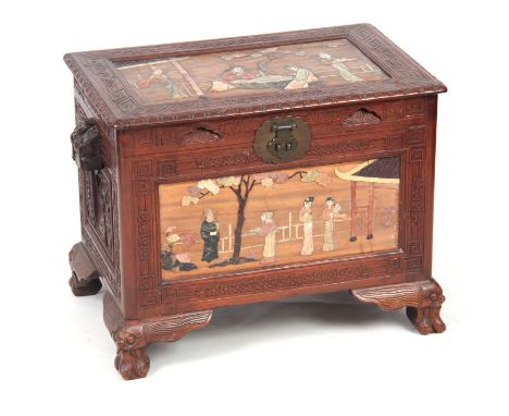 A CHINESE HARDWOOD FLOOR STANDING BOX with side handles, hinged top and brass fastening clasp, set with relief work figure pa
