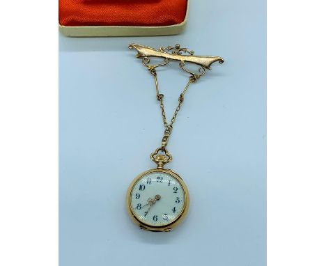 A Ladies gold pocket watch with enamel and semi precious stone decoration on a 9ct gold chain